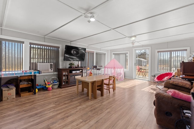 game room with hardwood / wood-style floors and cooling unit