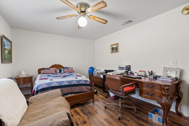 bedroom with dark hardwood / wood-style floors and ceiling fan