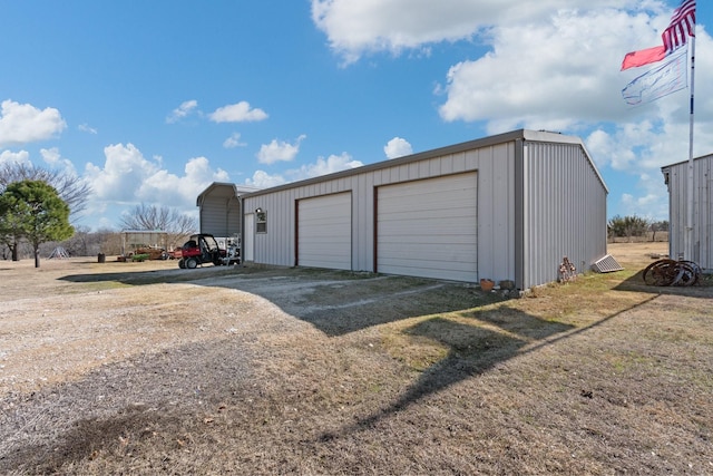 garage featuring a carport