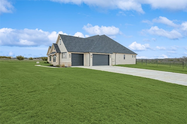 view of home's exterior with a garage and a yard