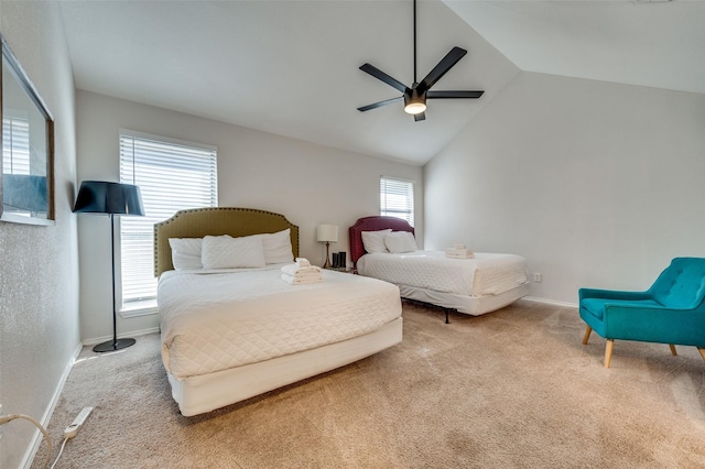 bedroom featuring ceiling fan, multiple windows, light carpet, and vaulted ceiling