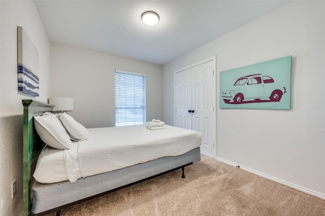 bedroom with a closet and carpet flooring