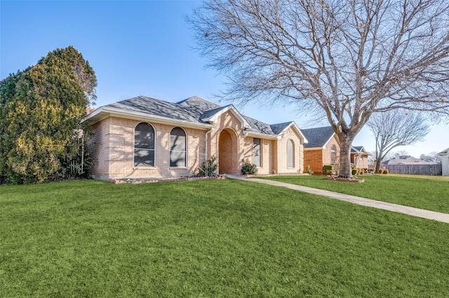 single story home with a front yard