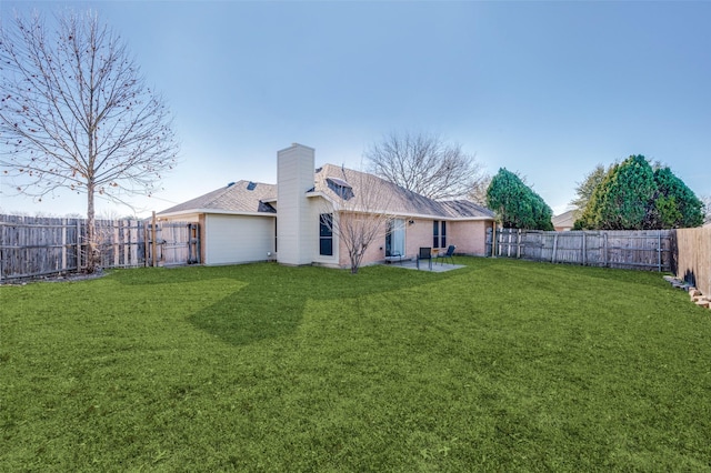 rear view of property with a patio area and a yard