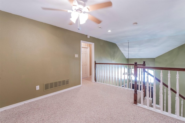 interior space featuring carpet and lofted ceiling