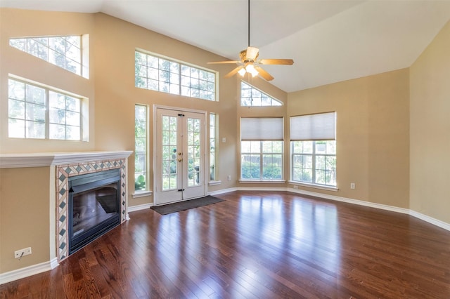 unfurnished living room featuring ceiling fan, vaulted ceiling, and dark hardwood / wood-style floors