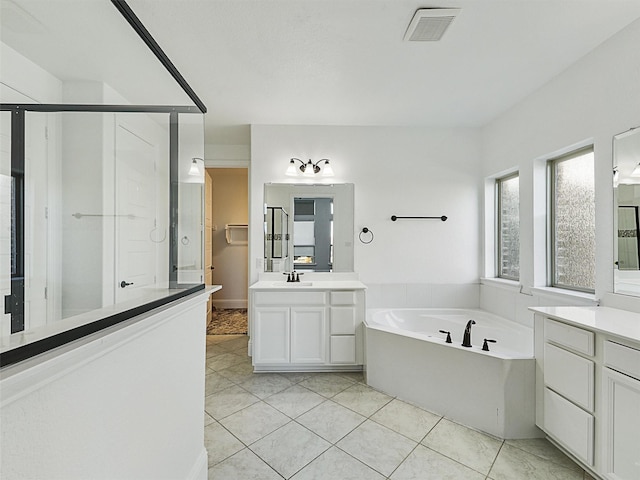 bathroom with vanity, tile patterned flooring, and independent shower and bath