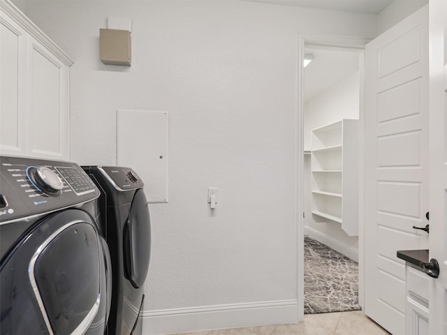 laundry room with cabinets and independent washer and dryer