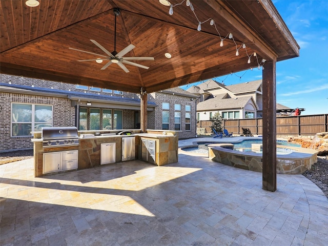 view of patio / terrace with ceiling fan, an outdoor kitchen, grilling area, and a fenced in pool