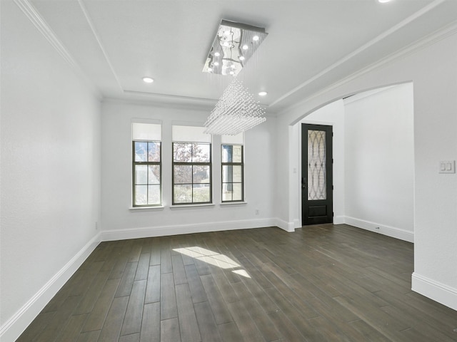 13750 Fernando Rd, Frisco, TX 75035 - foyer entrance with a chandelier, crown molding, arched walkways, dark wood finished floors, and baseboards