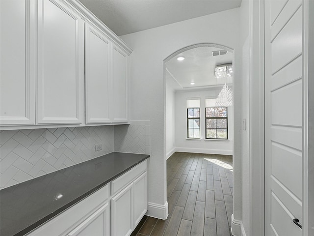 13750 Fernando Rd, Frisco, TX 75035 - hall featuring baseboards, arched walkways, and dark wood finished floors