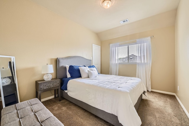 carpeted bedroom featuring vaulted ceiling