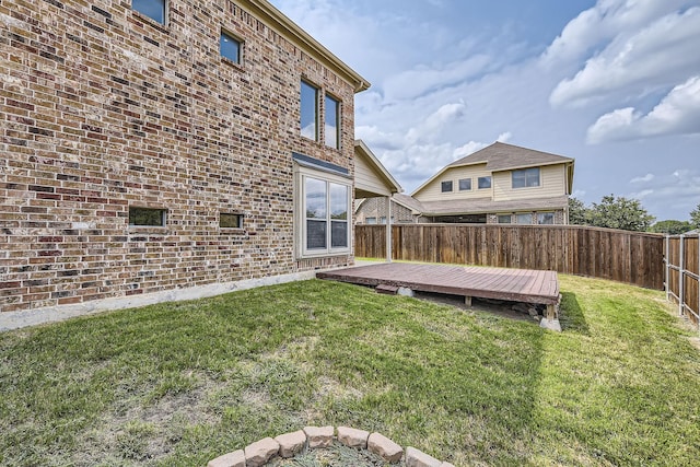 view of yard featuring a wooden deck