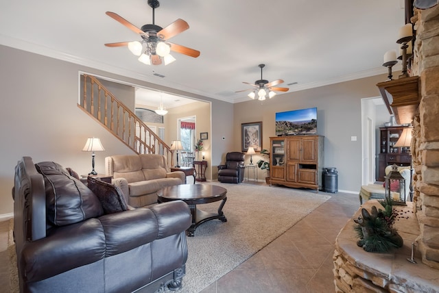 tiled living room featuring ornamental molding and ceiling fan