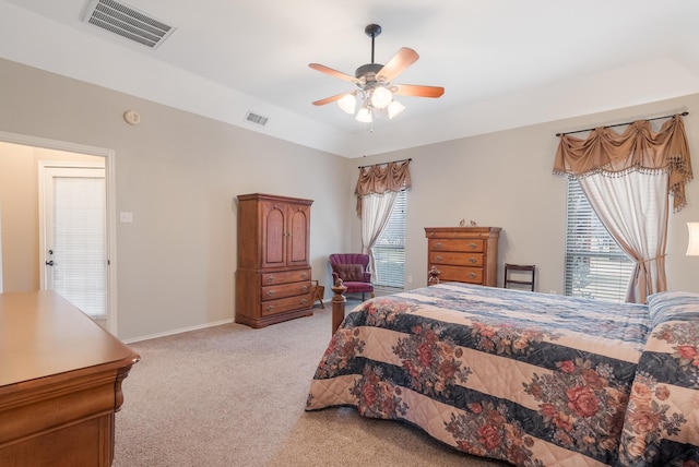 bedroom with ceiling fan and light carpet