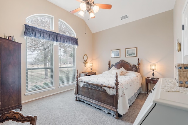 carpeted bedroom with vaulted ceiling and ceiling fan