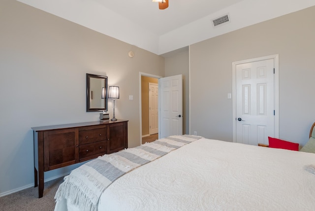 bedroom with ceiling fan and light colored carpet