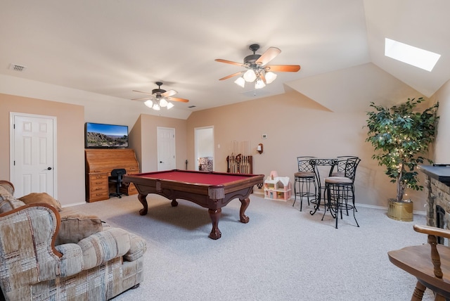 game room featuring ceiling fan, carpet flooring, vaulted ceiling with skylight, and billiards