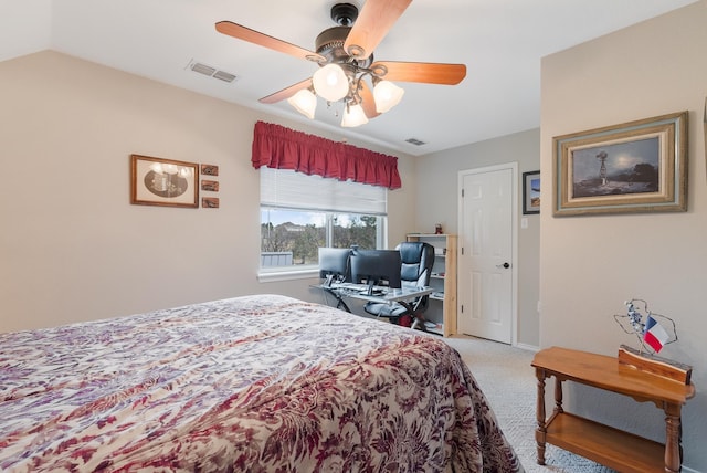 bedroom featuring ceiling fan, light carpet, and vaulted ceiling