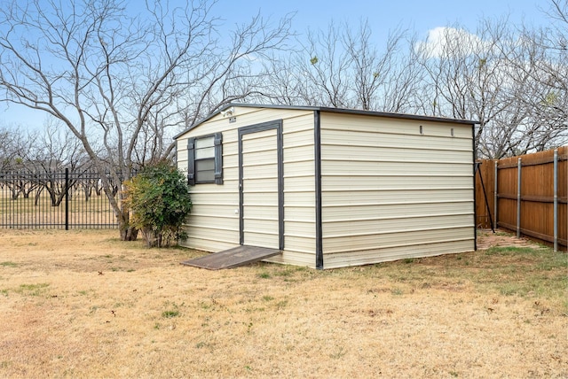 view of outbuilding with a lawn