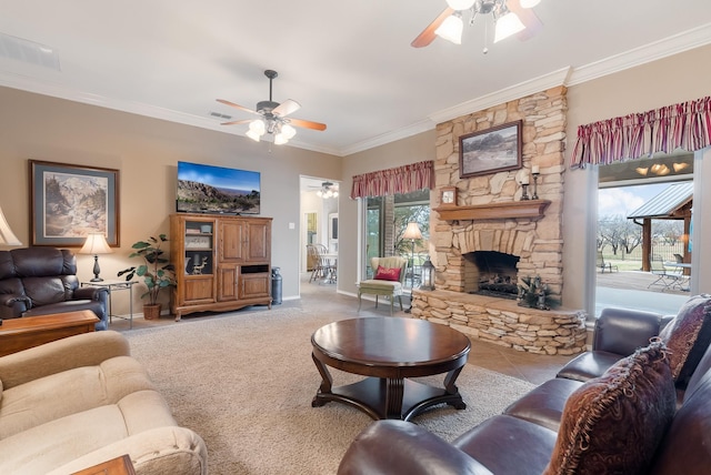 carpeted living room featuring a healthy amount of sunlight, a stone fireplace, and ornamental molding