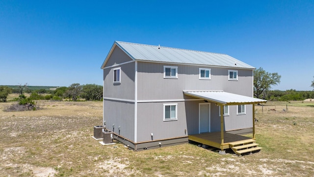 back of house with cooling unit