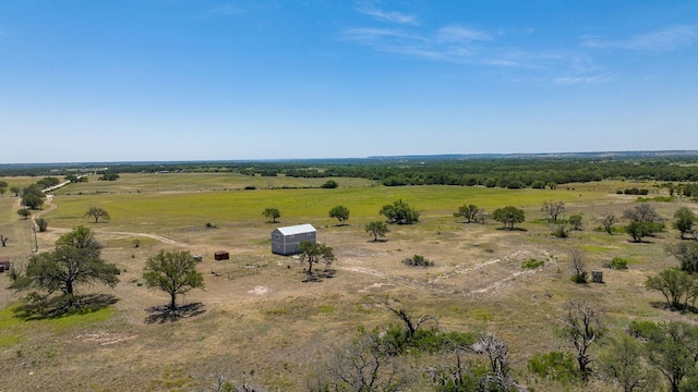 birds eye view of property featuring a rural view