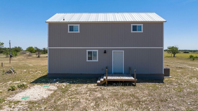 back of property featuring cooling unit