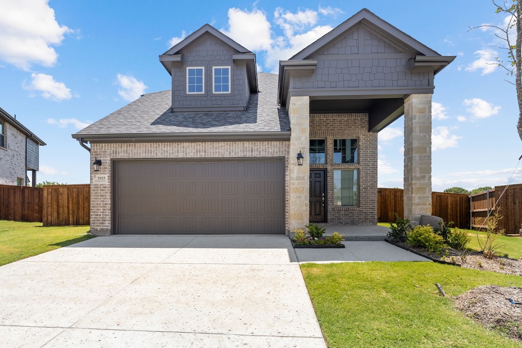 craftsman-style house with a garage and a front yard