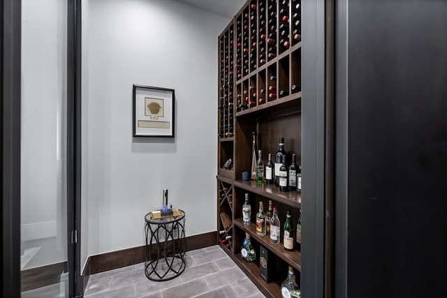 wine area with tile patterned flooring