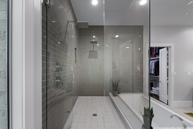 bathroom with shower with separate bathtub