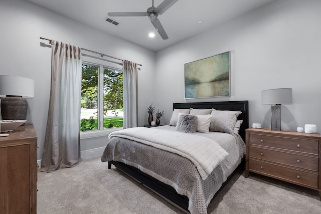 bedroom featuring ceiling fan and light carpet