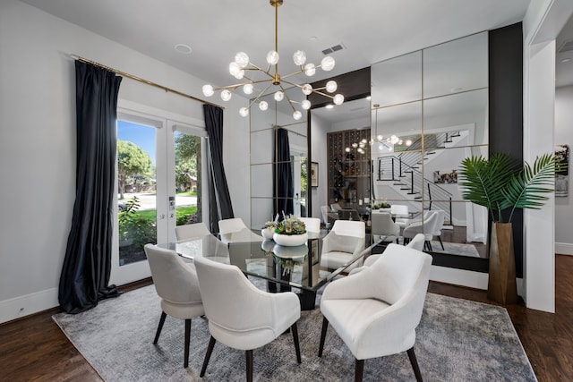 dining room with french doors, an inviting chandelier, and dark hardwood / wood-style flooring