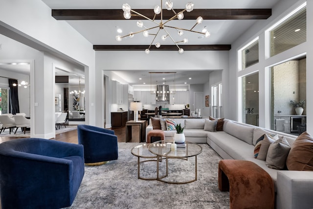 living room with wood-type flooring, an inviting chandelier, and beamed ceiling