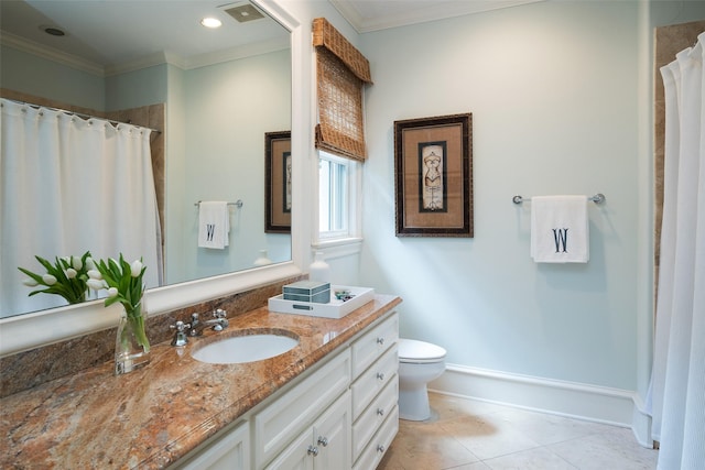 bathroom featuring tile patterned floors, toilet, ornamental molding, and vanity