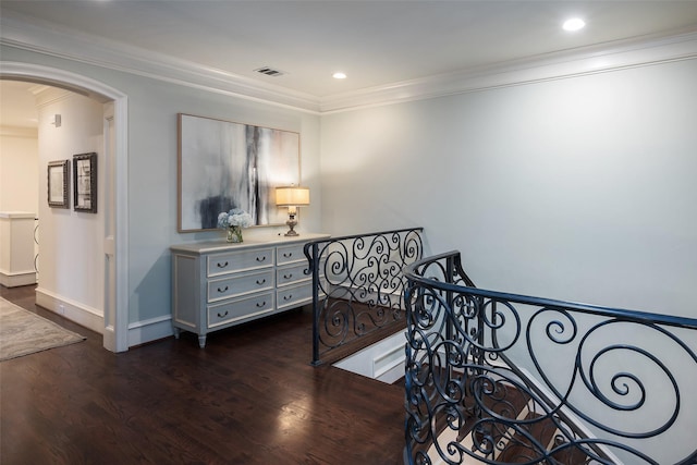 hall featuring dark wood-type flooring and ornamental molding