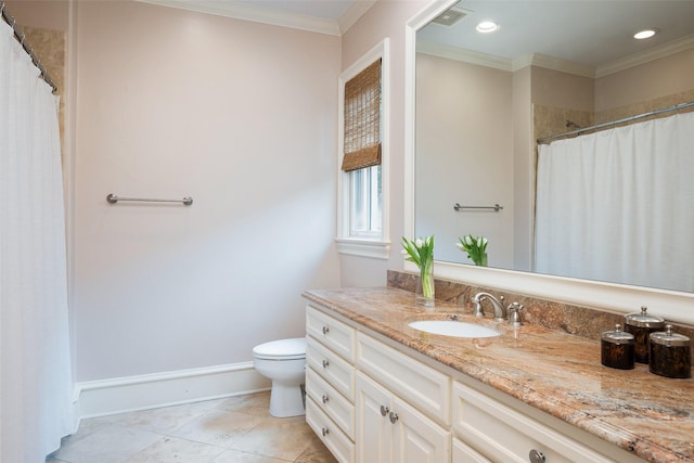 bathroom with tile patterned floors, toilet, vanity, and ornamental molding