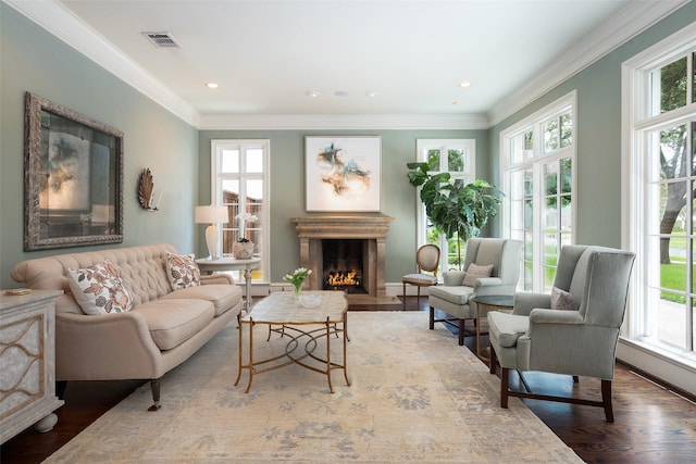 living room with hardwood / wood-style flooring and ornamental molding