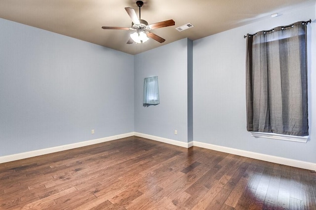 empty room with hardwood / wood-style flooring and ceiling fan