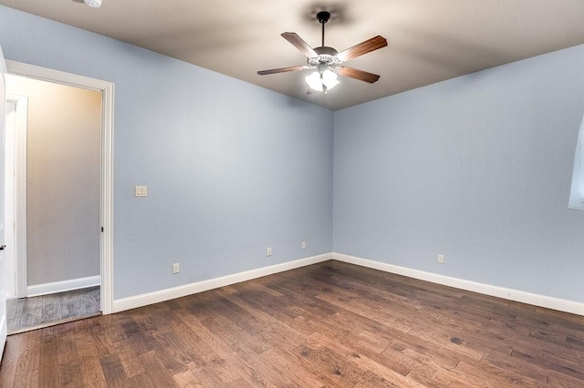 empty room featuring ceiling fan and hardwood / wood-style floors