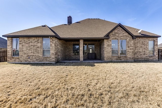 rear view of property featuring a patio