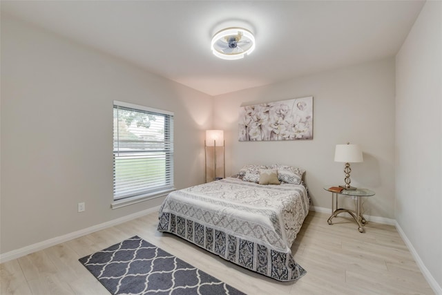 bedroom with hardwood / wood-style flooring