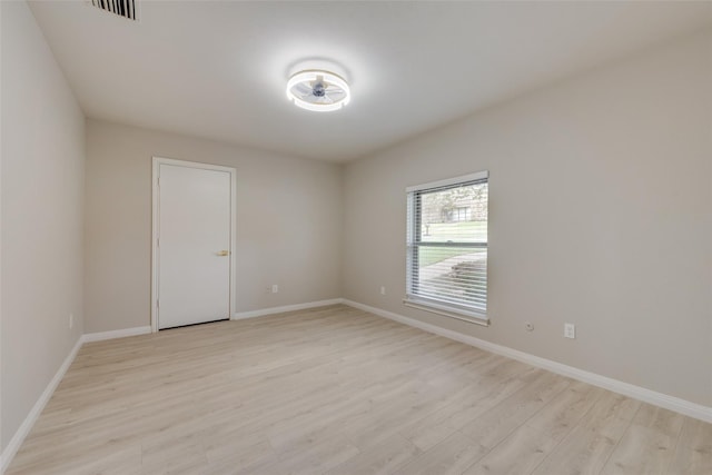 unfurnished room featuring light hardwood / wood-style flooring