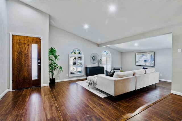 living room with vaulted ceiling with beams and dark hardwood / wood-style floors