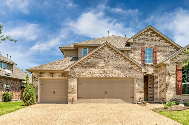 view of front of property with a garage