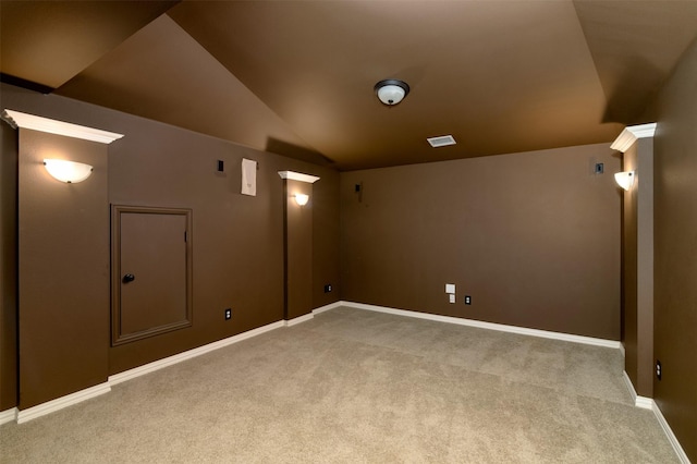 carpeted cinema featuring lofted ceiling