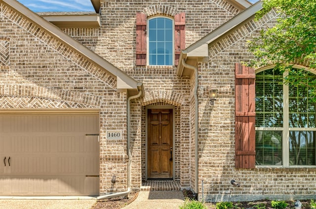 doorway to property featuring a garage