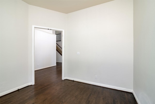 spare room featuring dark hardwood / wood-style floors