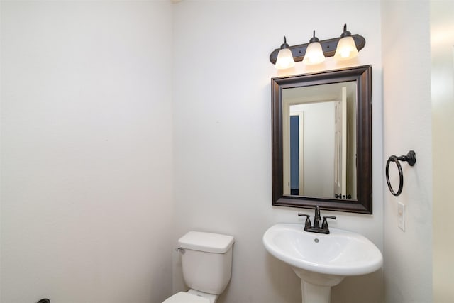 bathroom featuring sink and toilet