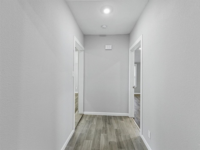 hall with light hardwood / wood-style floors